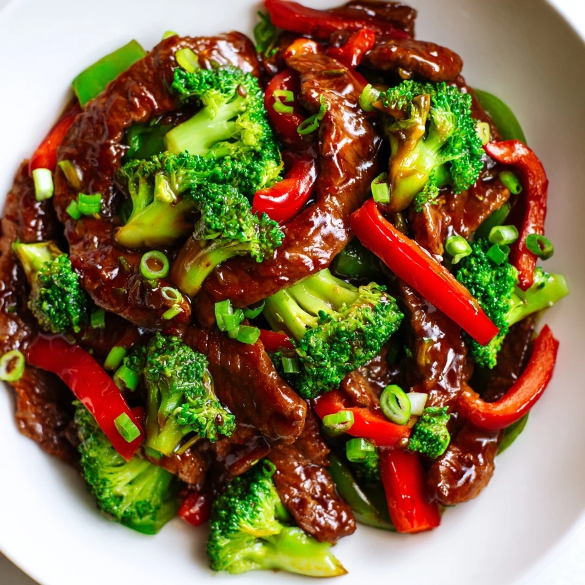 Steamy ginger and garlic aromas waft from this homemade Spicy Beef and Broccoli Stir Fry served over fluffy white rice.