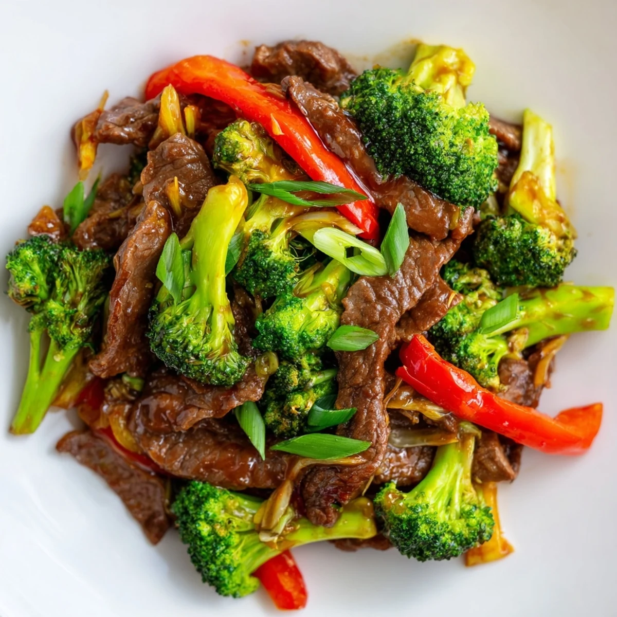 Tender flank steak and crisp broccoli florets glisten in the savory sauce of a quick Spicy Beef and Broccoli Stir Fry.