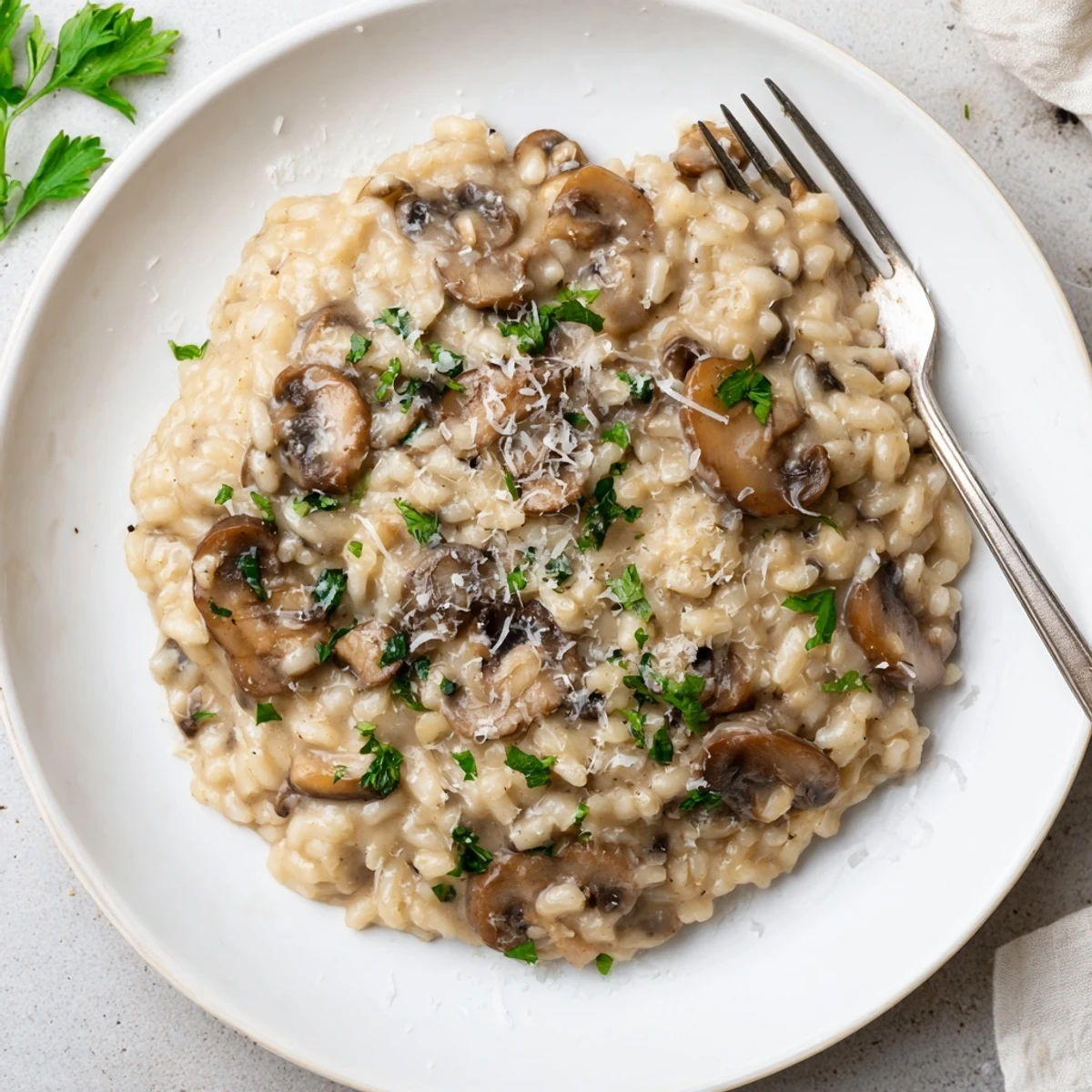 A warm Italian dish of Creamy Mushroom Risotto with rich texture and a rustic wooden spoon.