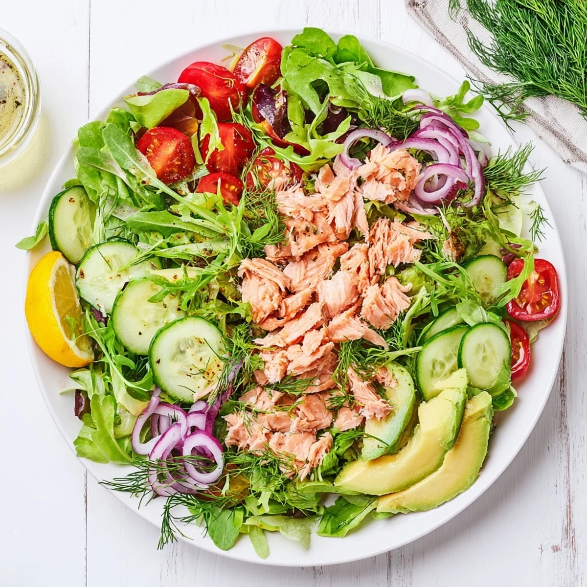 Fresh Ultimate Minute Salmon Salad featuring golden pan-seared salmon atop vibrant arugula, cucumber, and red onion with lemon honey dressing
