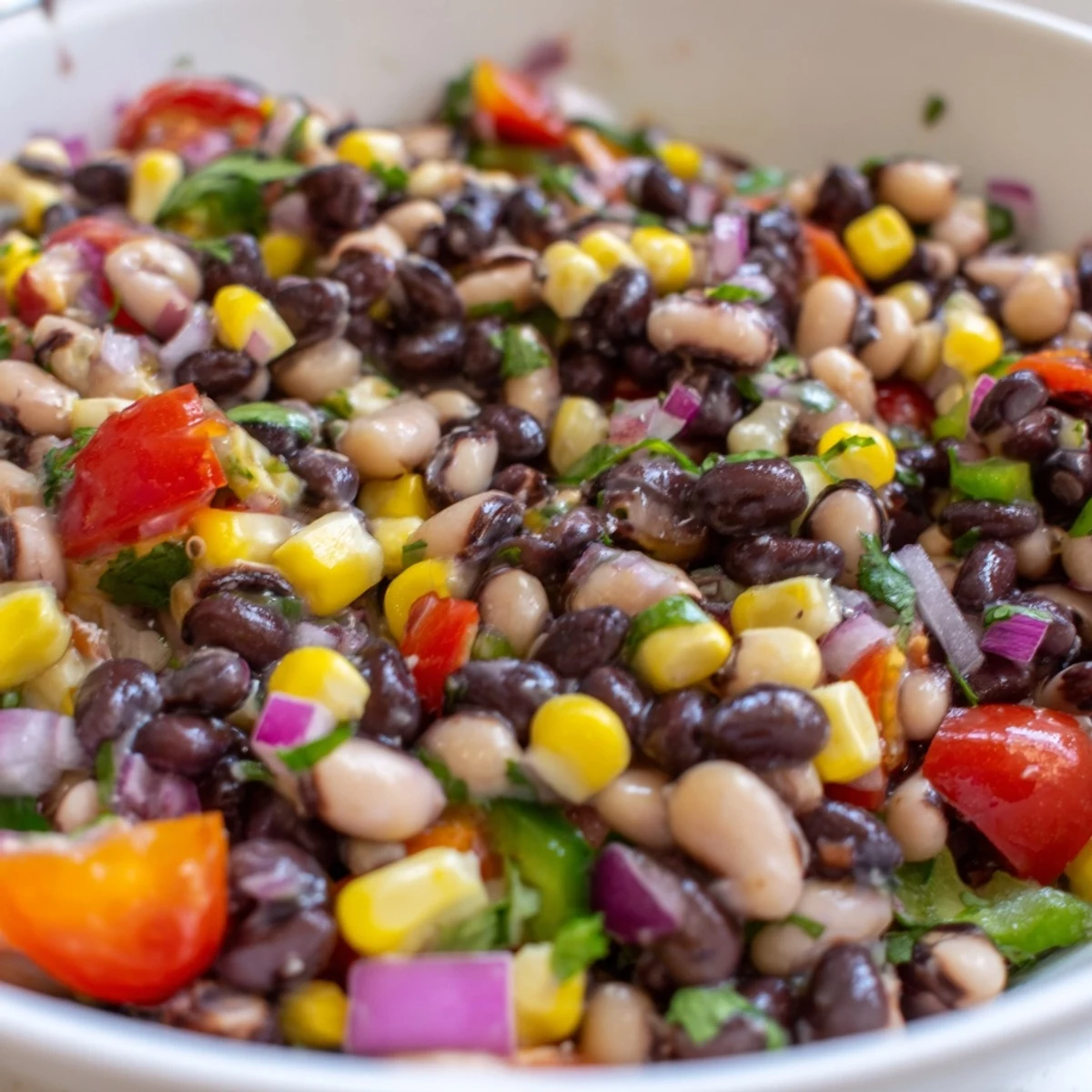 Creamy avocado tops this cowboy caviar recipe served with crispy tortilla chips.